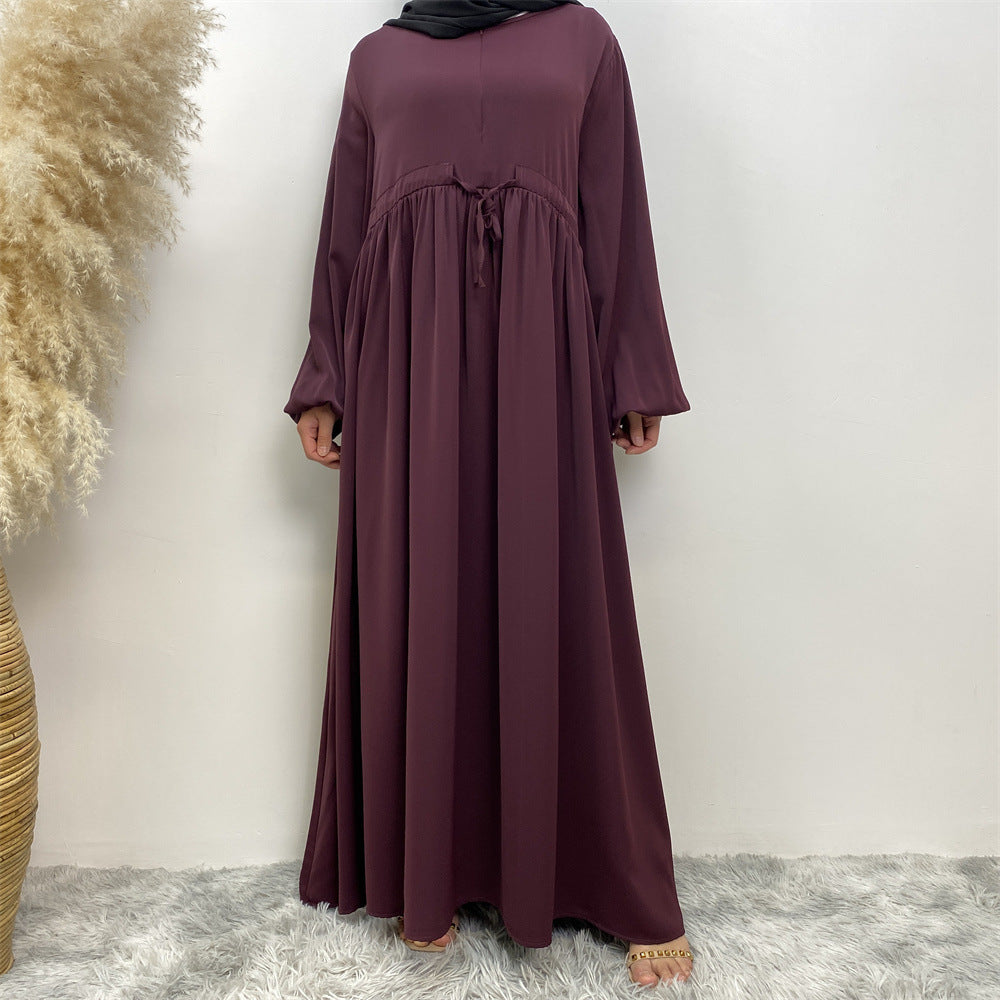 Robe trapèze élégante à manches extensibles et fermeture éclair sur le devant, de couleur unie, au design simple et musulman