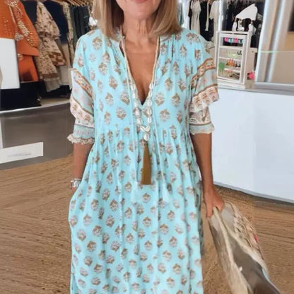 Vestido de talle alto con vuelo amplio, mangas farol y estampado de moda con escote en V