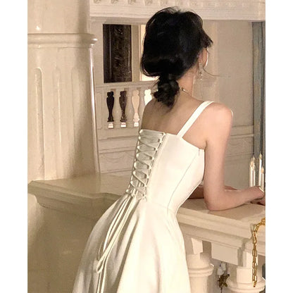 Robe mi-longue à bretelles blanches, élégante, française, décontractée, de soirée, de plage, sans manches, à lacets, rouge, coréenne, nouvelle collection été 2023