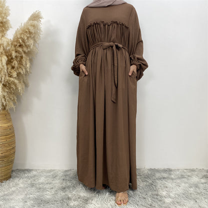 Robe musulmane à manches amples et poches latérales au Moyen-Orient à Dubaï